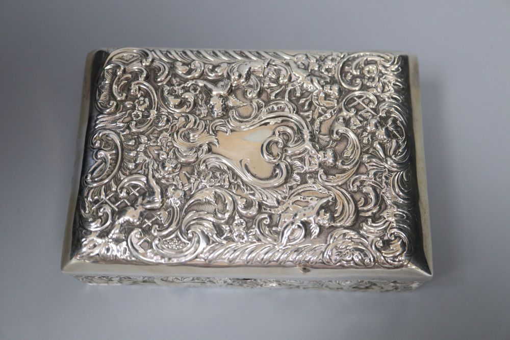 A late Victorian repousse silver mounted lidded rectangular box, with compartmental wooden interior, London, 1895 (a.f.),